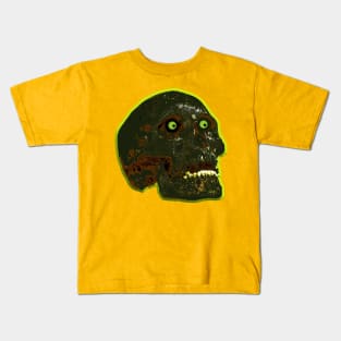 Burnt skull with glowing green eyes Kids T-Shirt